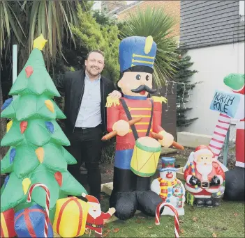  ?? Picture: Sarah Standing ?? CHRISTMAS SPIRIT
Dan Luter, also, left, registered manager at Alexandra Rose Care Home