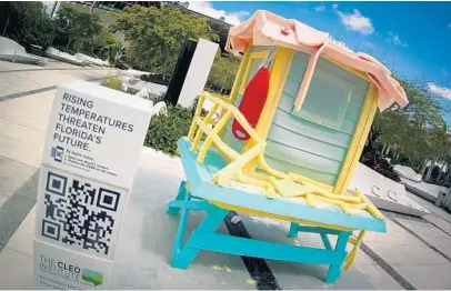  ?? ZUBI/COURTESY PHOTO ?? As the heat takes its toll, the lifeguard shack sculpture in Miami has begun melting. The roof and railing are the first to have degraded.