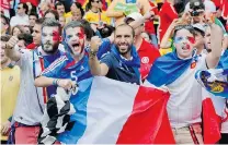  ?? JON SUPER/ THE ASSOCIATED PRESS ?? French fans cheer before a Group E World Cup soccer match between France and Honduras at the Estadio Beira- Rio on Sunday in Porto Alegre, Brazil. France blanked Honduras 3- 0.