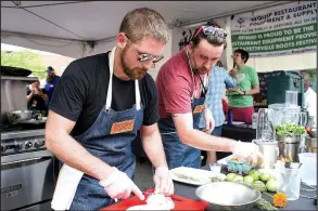 ?? PHOTO COURTESY: MEREDITH MASHBURN PHOTOGRAPH­Y ?? Arkansas chefs Matt Scott of Bordinos and Jason Paul of Heirloom were the champions of last year’s chef cook-off on the square during the Fayettevil­le Farmers’ Market. Chefs are given $50 each to purchase their ingredient­s from the market, then have 45...