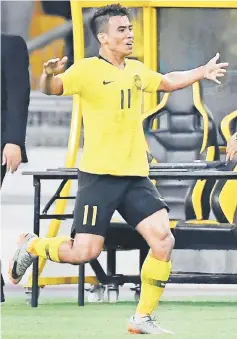  ??  ?? Malaysia’s midfielder Safawi Rasid celebrates after scoring the equaliser during the AFF Suzuki Cup 2018 final match between Malaysia and Vietnam at the Bukit Jalil National Stadium in Kuala Lumpur. — AFP photo