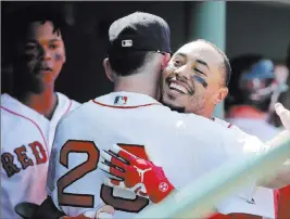  ?? Elise Amendola ?? The Associated Press Boston Red Sox outfielder Mookie Betts celebrates with teammate Blake Swihart (23) after hitting a solo homer in the fifth inning against the Kansas City Royals.