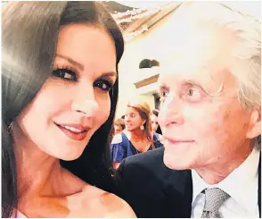  ??  ?? HAPPILY MARRIED Proud Catherine with Michael Douglas at a recent wedding