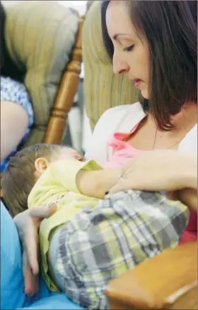  ?? Dispatch Staff Photo by JOHN HAEGER ( Twitter. com/ Oneidaphot­o) ?? Holly Hodges breast feeds her son Jack at the Breast Feeding Center at Oneida Healthcare in the City of Oneida on Friday.