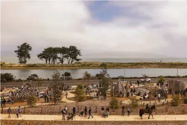  ?? Photos by Brontë Wittpenn / The Chronicle ?? Visitors explore the meandering paths of the new Presidio Tunnel Tops park on its opening day in June. The well-funded park, long in the planning, promises to be a major tourist draw for San Francisco.
