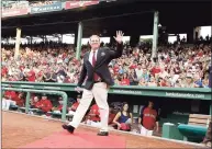  ?? Winslow Townson / Associated Press ?? Former Red Sox pitcher Curt Schilling waves to the crowd after being introduced as a new member of the Red Sox Hall of Fame before a game against the Twins at Fenway Park in 2012.