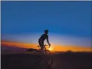  ?? JOSE CARLOS FAJARDO STAFF ?? Bicyclist Beau Oyler of Walnut Creek rides his bicycle up Mount Diablo at sunset on Friday.