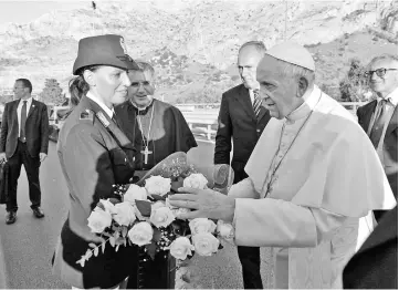  ??  ?? Pope laying a wreath as he pays hommage to the victims of the May 23, 1992 mafia bombings, at the Capaci memorial. — AFP photo