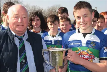  ??  ?? Gorey President Frank Deering presents the cup to team captain Brian Cushe.