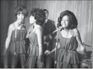  ?? (AP file photo) ?? Mary Wilson (center) performs with Florence Ballard (left) and Diana Ross during a Oct. 8, 1964, reception for The Supremes at a hotel in London.