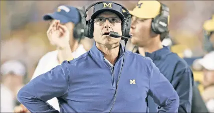  ?? Getty Images ?? FIRST ‘L’ COMING: Jim Harbaugh and his Michigan team will fall to Big Ten rival Wisconsin on Saturday, suffering their first loss of the season.