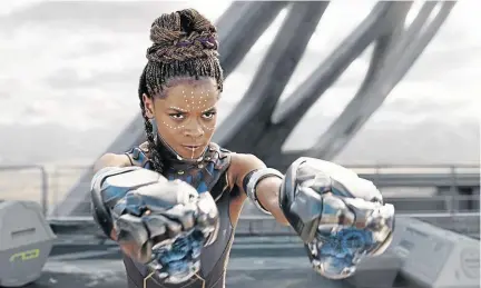  ?? / MARVEL STUDIOS ?? Shuri (Letitia Wright) is pictured in a scene from Black Panther. The move to make her character the focal point of the upcoming sequel is welcomed by the writer.