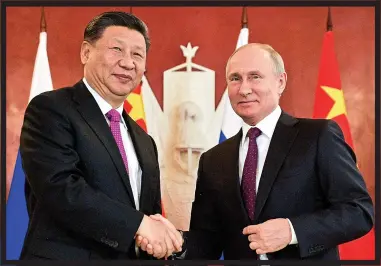  ??  ?? POWERHOUSE­S: China’s president Xi Jinping with Russian leader Vladimir Putin in June