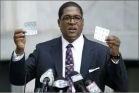  ?? ASSOCIATED PRESS ?? Bill Cosby’s spokesman Andrew Wyatt holds up packages of Benadryl tablets as he speak to the media during a break in Cosby’s sexual assault trial Tuesday at the Montgomery County Courthouse in Norristown.