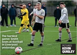  ?? ?? The hardest game: Smith loses at football in Liverpool yesterday
PICTURES: KEVIN QUIGLEY