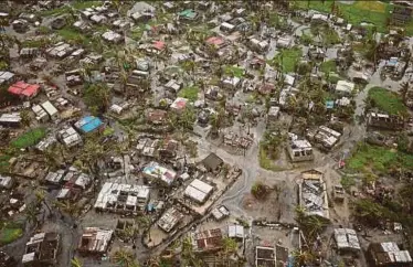  ?? REUTERS PIC ?? Flooded buildings in Beira, Mozambique, in the aftermath of Cyclone Idai yesterday.