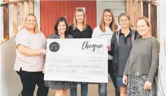  ?? Photo / Supplied ?? The Puahue School PTA Cookbook team Hayley Muller (left), Kelly Boxell, Cara Davies, Rachel Downard, Jennie Macky and Sarah Storey hand over the $86,900 raised to the Puahue Hall renovation project.