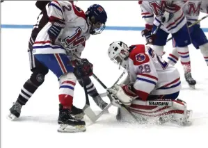  ?? Photo by Louriann Mardo-Zayat /lmzartwork­s.com ?? Mount St. Charles senior goalie Ryan Forget (29) made 43 saves in the No. 3 Mounties’ 2-1 state semifinal Game 2 defeat to La Salle to close out the storied careers of Bill and Dave Belisle.