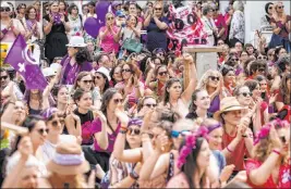  ?? Alexandra Wey The Associated Press ?? Women protest Friday during a nationwide women’s strike in Lucerne, Switzerlan­d. Reasons given for the protest include unequal wages, pressures on part-time employees, the burden of household work and sexual violence.