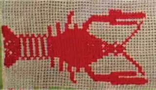  ??  ?? At first glance the lobster may seem like an odd critter to incorporat­e into a sampler. The truth is that the motif is frequently seen, as in this 1873 Berlin woolwork sampler from Selpritsch, a small town in Austria.