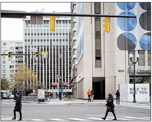  ?? Bloomberg/ANDREW HARRER ?? Pedestrian­s walk in the Crystal City area of Arlington, Virginia, earlier this month.