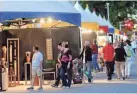  ?? DOUG HOKE/THE OKLAHOMAN FILE ?? People check out the artwork displayed in a row of tents along Colcord Drive at the 2019 Festival of the Arts.