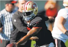  ?? DAVID ZALUBOWSKI/ASSOCIATED PRESS ?? Quarterbac­k Colin Kaepernick displayed no discomfort in team drills Thursday in Colorado as his teammates took part in a training session with the Broncos.