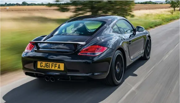  ??  ?? In the black! Cayman 987 R is a swift if not ballistic performer. It’s lighter on its tyres than the next generation GT4
Interior is basic, but not totally lacking in amenities. Default spec was sans air con and infotainme­nt, but most specced up as a no-cost option
