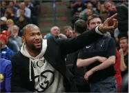  ??  ?? AP FILE PHOTO BY RICK BOWMER In this 2018 photo, Golden State Warriors center Demarcus Cousins points to Utah Jazz fans in the first half during an NBA basketball game against the Utah Jazz in Salt Lake City.