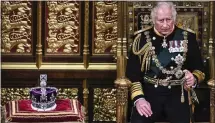  ?? BEN STANSALL — POOL PHOTO VIA AP ?? Britain's Prince Charles sits by the the Imperial State Crown in the House of Lords Chamber during the state opening of Parliament, in the Houses of Parliament in London on Tuesday.