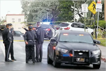  ?? PHOTOS BY LUIS SÁNCHEZ SATURNO/THE NEW MEXICAN ?? Deputy Chief Ben Valdez said Santa Fe police recovered at least one firearm from inside the white SUV where Santa Fe couple Ernestine and Jessie Saucedo, above, were found shot to death just after noon Thursday.