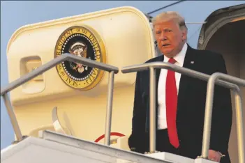  ?? ASSOCIATED PRESS ?? PRESIDENT DONALD TRUMP ARRIVES at Reno-Tahoe Internatio­nal Airport in Reno, Nev., on Saturday to travel to a rally in Minden, Nev.