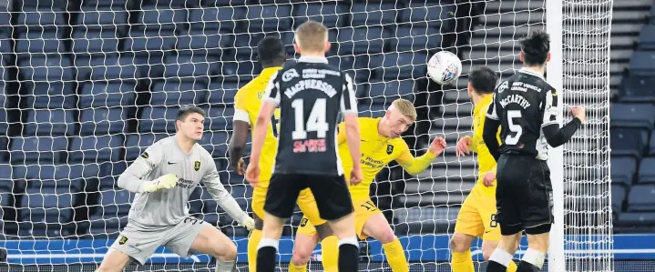  ??  ?? Close but no cigar
Conor McCarthy’s goal-bound header is cleared off the line during St Mirren’s League Cup semi-final with Livingston