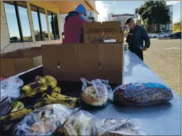  ?? RICH FREEDMAN — TIMES-HERALD ?? Food is put outside of First Baptist Church on tables for anyone to help themselves as part of the Sparrow Project.