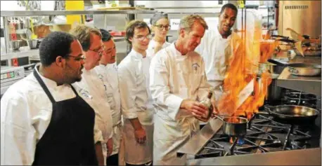  ??  ?? Delaware County Community College Culinary Arts students work with Chef Peter Gilmore, Culinary Arts Program Manager. The college is hosting a Culinary and Hospitalit­y Career Night on April 11 to give prospectiv­e and current students a chance to learn...