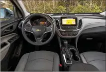  ??  ?? The interior of the 2018 Chevrolet Equinox features an intuitive design and takes advantage of the vehicle’s all-new architectu­re to offer a down-and-away instrument panel.