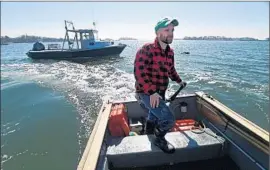  ?? Brad Horrigan ?? BREN SMITH, pictured off Branford, Conn., says his vertical system of raising shellf ish and kelp benefits the planet as well as consumers at a crucial time.