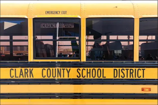  ?? YASMINA CHAVEZ ?? A student waits to get off a bus Aug. 9 at Hannah Marie Brown Elementary School in Henderson. The Clark County School District’s transporta­tion department’s roster of bus drivers is about 15% down from its full complement, which is causing havoc for children who ride a school bus daily and their parents. District officials say they’re trying to address the issue, but hiring enough qualified drivers is easier said than done.