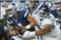  ?? MICHAEL AINSWORTH — THE ASSOCIATED PRESS ?? Tennessee Titans nose tackle Austin Johnson (94) sacks Dallas Cowboys quarterbac­k Dak Prescott (4) during the second half of an NFL football game, Monday in Arlington, Texas.