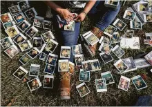  ?? Jon Shapley / Staff photograph­er ?? Rikki Saldivar goes through family photos at a house that belonged to her grandparen­ts, who died, along with four other family members, while trying to escape Harvey’s wrath.