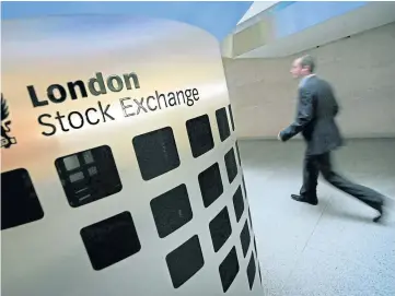  ?? ?? TURMOIL: The FTSE 100 in London was trading down as much as 2.3%.