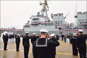  ?? Jonathon Gruenke / TNS ?? Sailors salute during a remembranc­e ceremony on Monday morning commentati­ng the 20th anniversar­y of the attack on USS Cole.