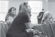  ?? STAFF PHOTO BY ERIN O. SMITH ?? Giselle Palmer, chairwoman of the Hamilton County Education Associatio­nFund for Children and Public Education, listens in on the Hamilton County School Board meeting Thursday.