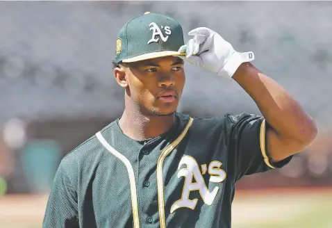  ?? ASSOCIATED PRESS FILE PHOTOS ?? Oakland Athletics draft pick Kyler Murray announced via Twitter on Monday that he was ‘firmly and fully committing my life and time to becoming an NFL quarterbac­k.’ His statement made no mention of baseball, the A’s or the $4.6 million deal he reached with them in June, with the promise to play only baseball after the 2018 college football season.