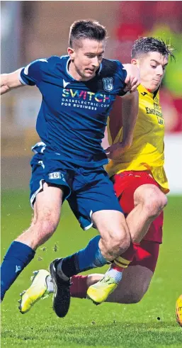  ?? Picture: SNS. ?? Dundee’s Cammy Kerr and Partick Thistle’s Alex Jones compete for the ball in the game the Dark Blues won on Saturday.