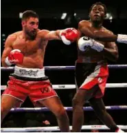 ??  ?? BATTLING: Benn [left] does show some power against Peynaud, while Buglioni [above] rebuilds after losing the British lightheavy­weight title