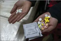  ?? JOAO SILVA — THE NEW YORK TIMES ?? Here are the five daily pills a patient with XDR-TB, extensivel­y drugresist­ant tuberculos­is, in the Nix-TB trial is required to take, left, and the 40daily pills a typical regimen in South Africa requires, displayed at Sizwe Tropical Diseases Hospital in Johannesbu­rg.