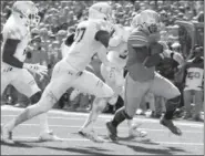  ??  ?? Ohio State running back Ezekiel Elliott scores a touchdown against Maryland during the four th quar ter Oct. 10.