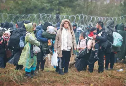  ?? / Afp ?? Migrantes en la región de Grodno, frontera de Bielorrusi­a con Polonia.