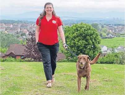  ?? Picture: Steven Brown. ?? Personnel recovery officer Susie Wilkie with chocolate labrador Keda.